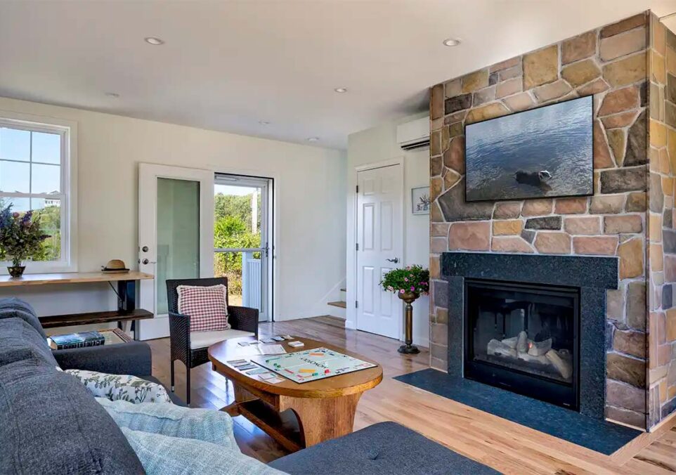 living room and fireplace of one of our newest cottages in our collection of Block Island Hotels