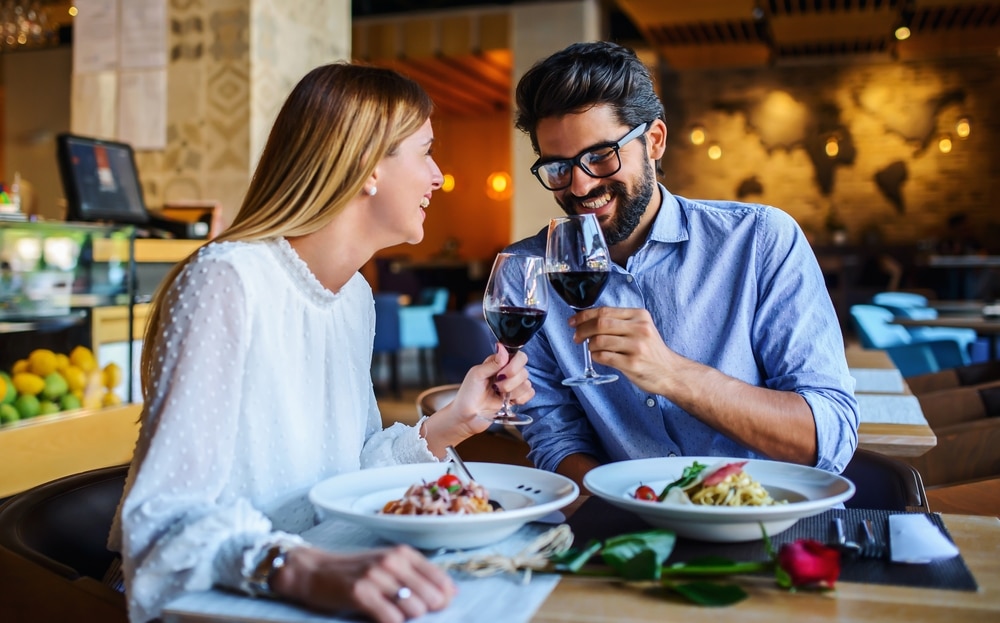 Couple eating a meal and drinking wine at one of the best restaurants on Block Island